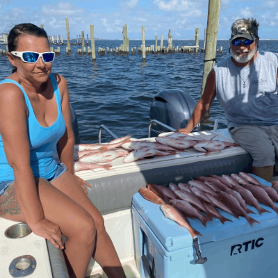 a woman sitting on a boat in the water