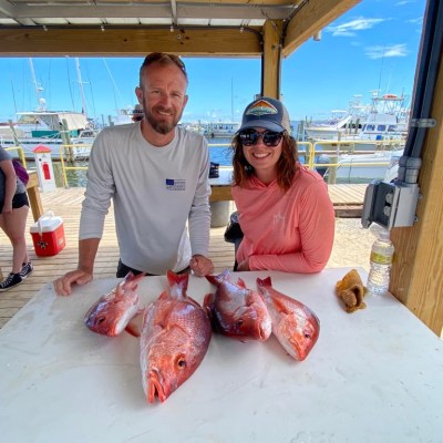 a person holding a fish