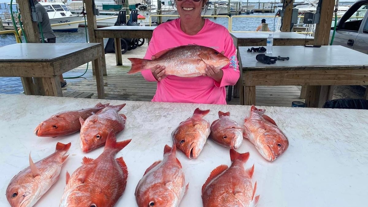 a person holding a fish