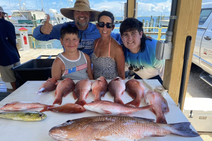 a person holding a fish