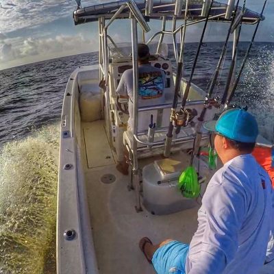 a man sitting on a boat in the water